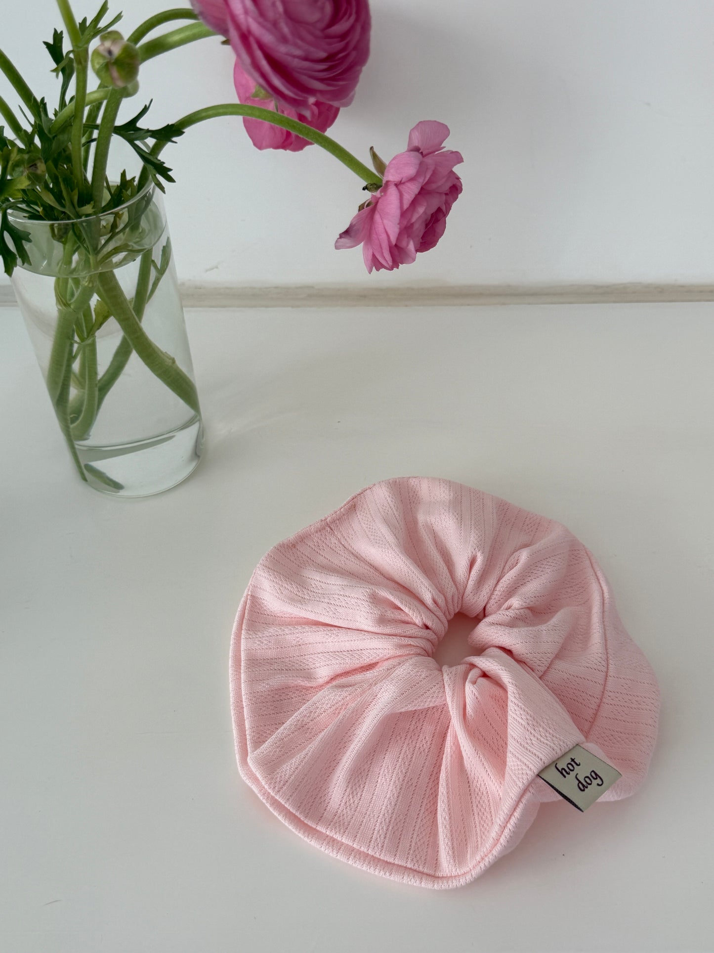 Pointelle Scrunchie in blush pink, close-up of the pointelle knit texture