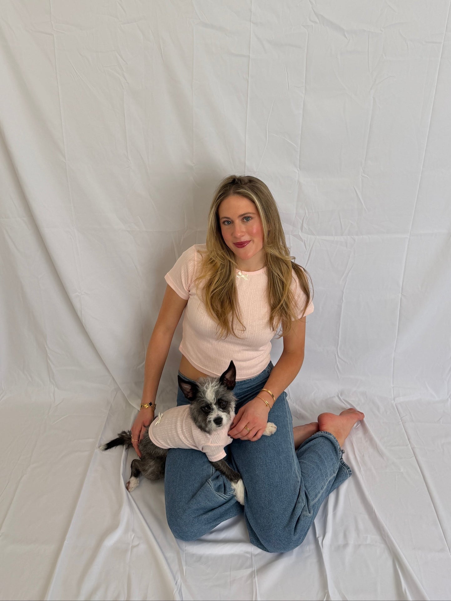 hot dog blush pink pointelle baby tee, dog tee, bandana, and scrunchie set. Model wears baby tee and jeans.